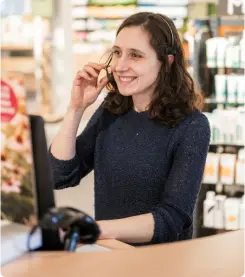 An employee providing assistance to a customer